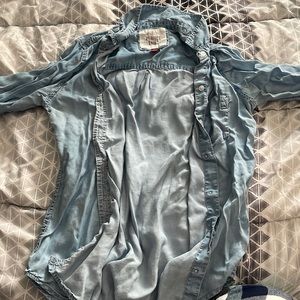 A thin button up long sleeve. can be worn with a shirt underneath or without.